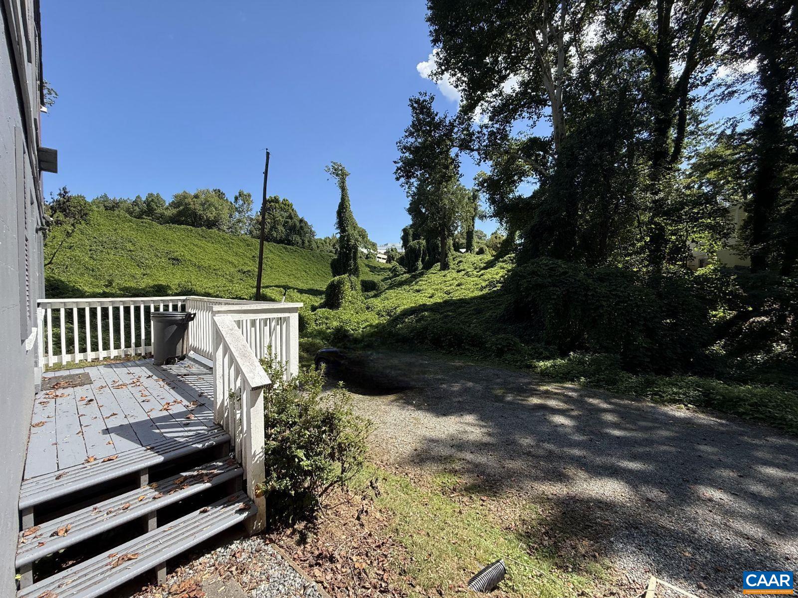 301 Paton Street, Unit A & B Charlottesville, VA 22903 - Photo 4 of 40 a view of a deck with a floor to ceiling window next to a yard