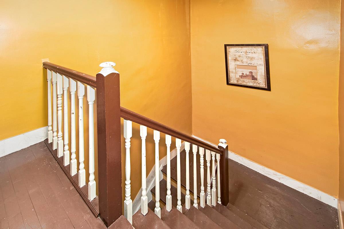 4016 Wilder Avenue Bronx, NY 10466 - Photo 16 of 17 a view of a hallway with wooden floor and a potted plant