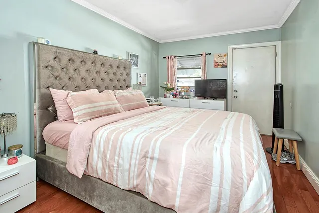 a bedroom with a bed and a couch