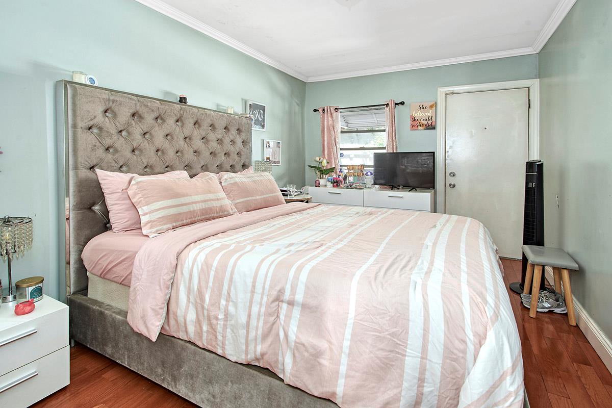 4016 Wilder Avenue Bronx, NY 10466 - Photo 4 of 17 a bedroom with a bed and a couch