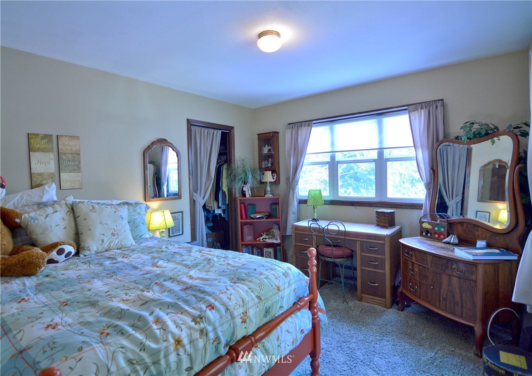 590 West Pole Road Ferndale, WA 98248 - Photo 12 of 40 a bed room with a bed window and a mirror