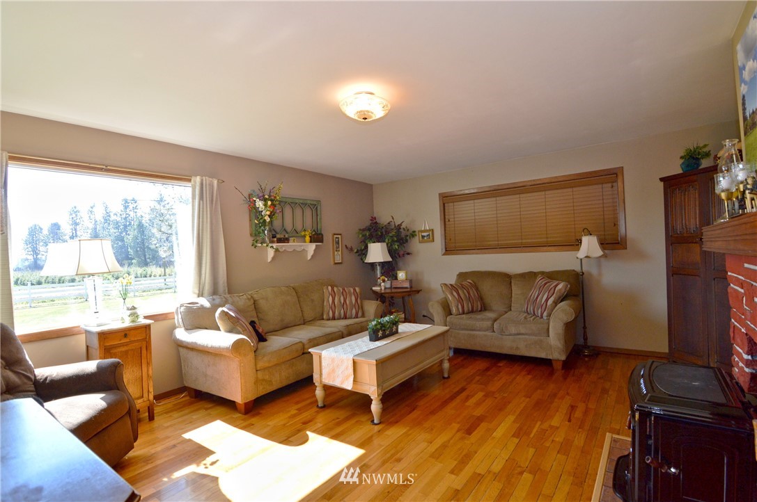 590 West Pole Road Ferndale, WA 98248 - Photo 14 of 40 a living room with furniture and a flat screen tv