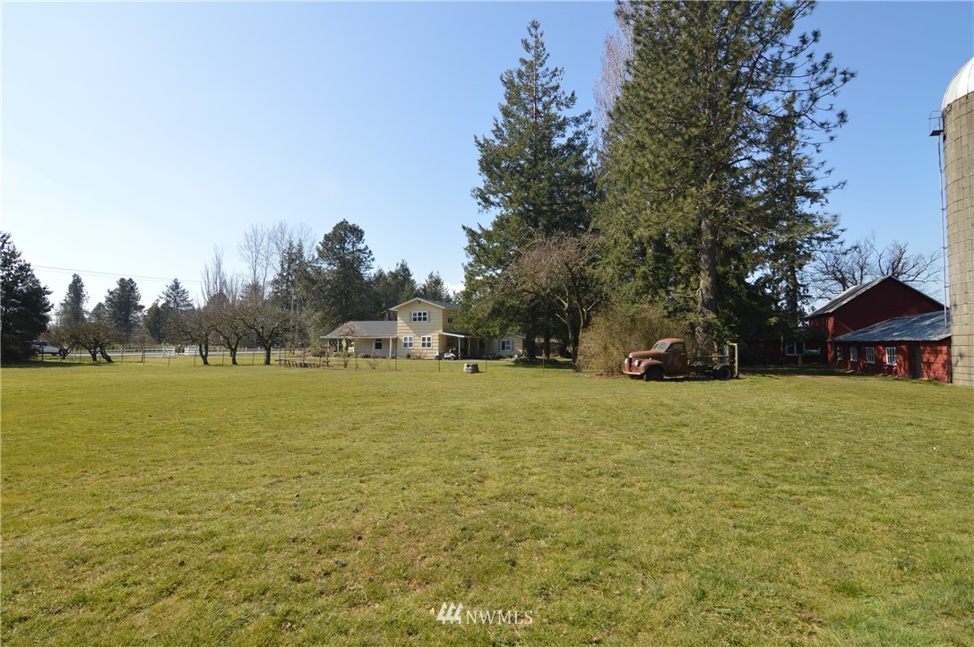 590 West Pole Road Ferndale, WA 98248 - Photo 29 of 40 a front view of a house with a yard and trees