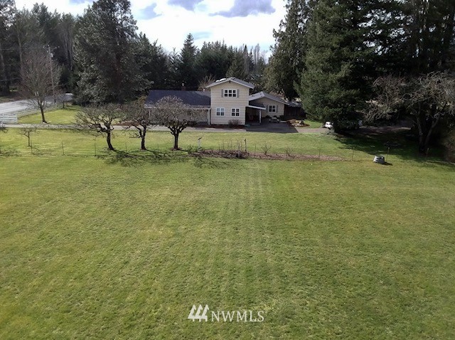 590 West Pole Road Ferndale, WA 98248 - Photo 4 of 40 a view of a garden with lawn chairs