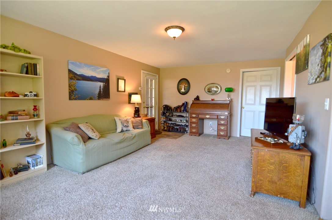 590 West Pole Road Ferndale, WA 98248 - Photo 34 of 40 a living room with furniture and a flat screen tv