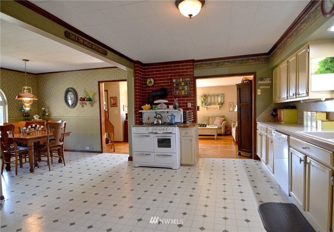 590 West Pole Road Ferndale, WA 98248 - Photo 35 of 40 a kitchen with stainless steel appliances kitchen island granite countertop a refrigerator and a stove top oven