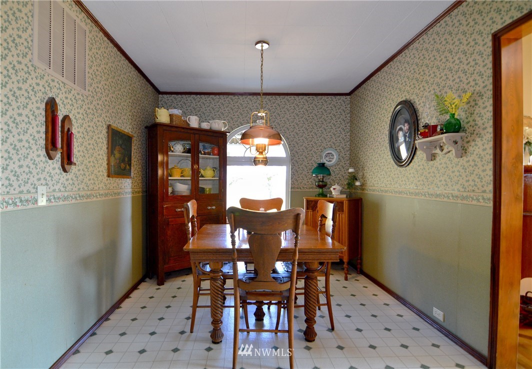 590 West Pole Road Ferndale, WA 98248 - Photo 36 of 40 a dining room with furniture window and wooden floor