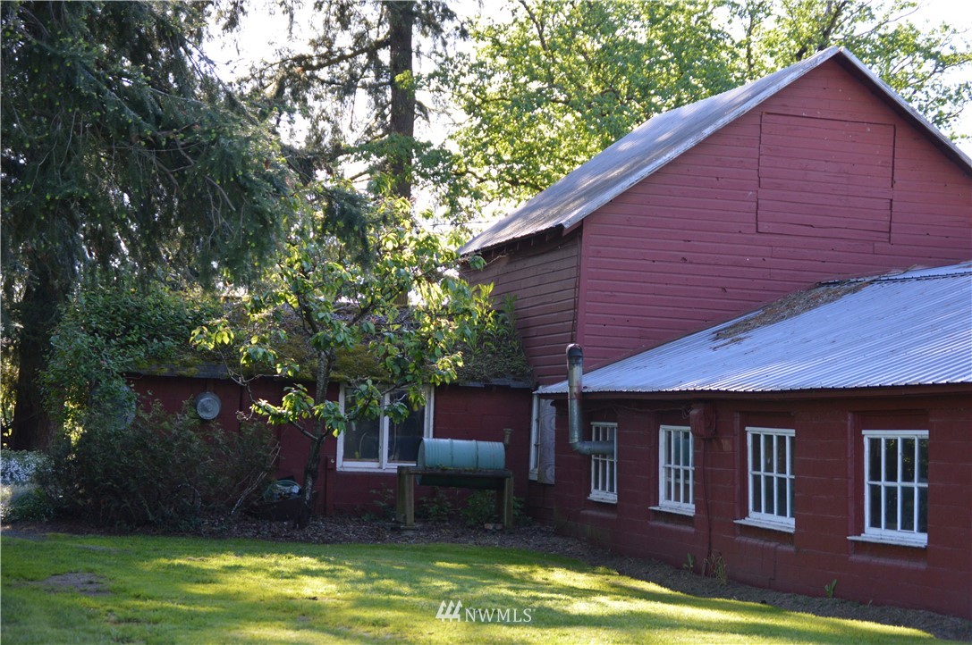 590 West Pole Road Ferndale, WA 98248 - Photo 40 of 40 a backyard of a house with large trees and a small yard