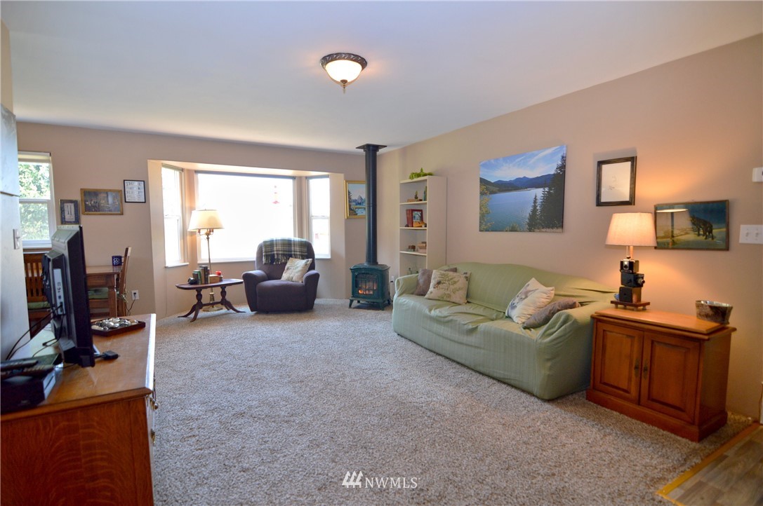 590 West Pole Road Ferndale, WA 98248 - Photo 8 of 40 a living room with furniture and a flat screen tv