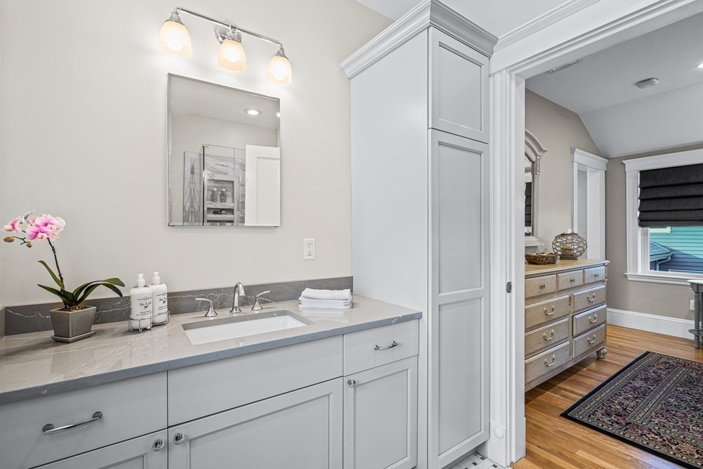 9 Laird Road Medford, MA 02155 - Photo 23 of 41 a bathroom with a sink and a mirror