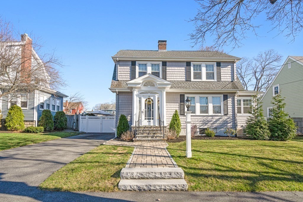 9 Laird Road Medford, MA 02155 - Photo 3 of 41 a front view of a house with a yard