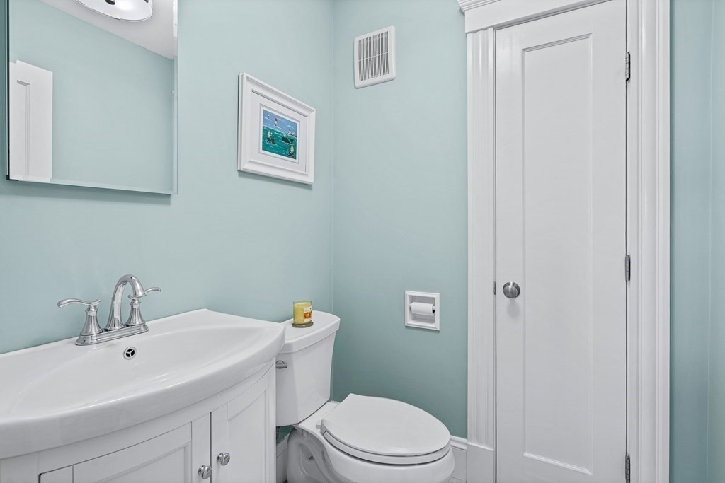 9 Laird Road Medford, MA 02155 - Photo 5 of 41 a bathroom with a sink mirror and toilet