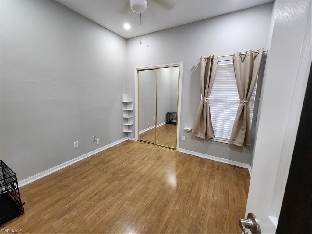 10702 Rio Mar Circle Estero, FL 33928 - Photo 14 of 21 a view of empty room with wooden floor