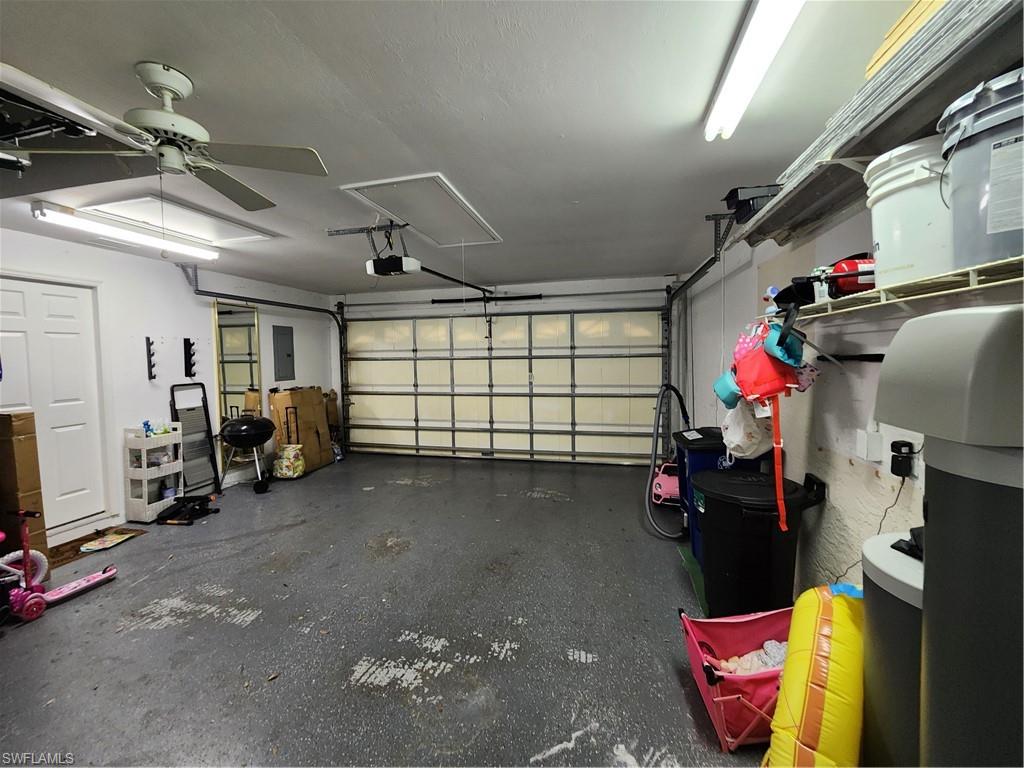 10702 Rio Mar Circle Estero, FL 33928 - Photo 18 of 21 a view of a garage with storage