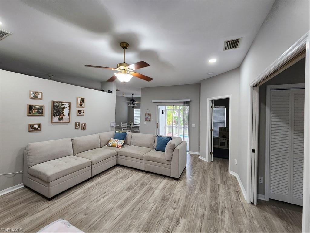 10702 Rio Mar Circle Estero, FL 33928 - Photo 4 of 21 a living room with furniture and a large window