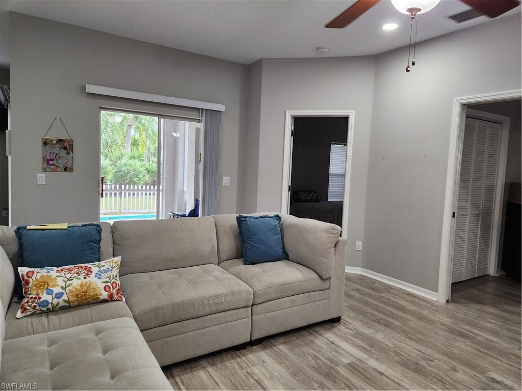 10702 Rio Mar Circle Estero, FL 33928 - Photo 5 of 21 a living room with furniture and a window