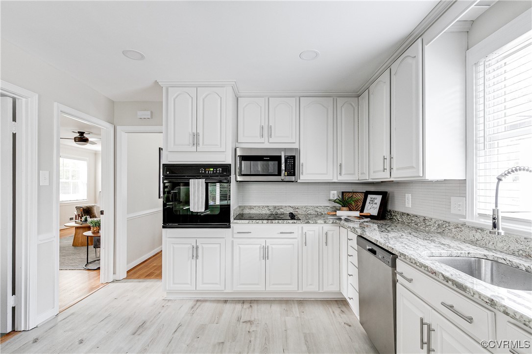 10231 Epsilon Road Richmond, VA 23235 - Photo 15 of 42 a kitchen with stainless steel appliances granite countertop a stove a sink and a refrigerator