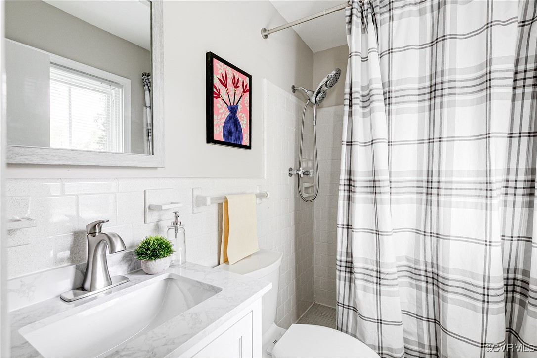 10231 Epsilon Road Richmond, VA 23235 - Photo 26 of 42 a bathroom with a sink and a toilet