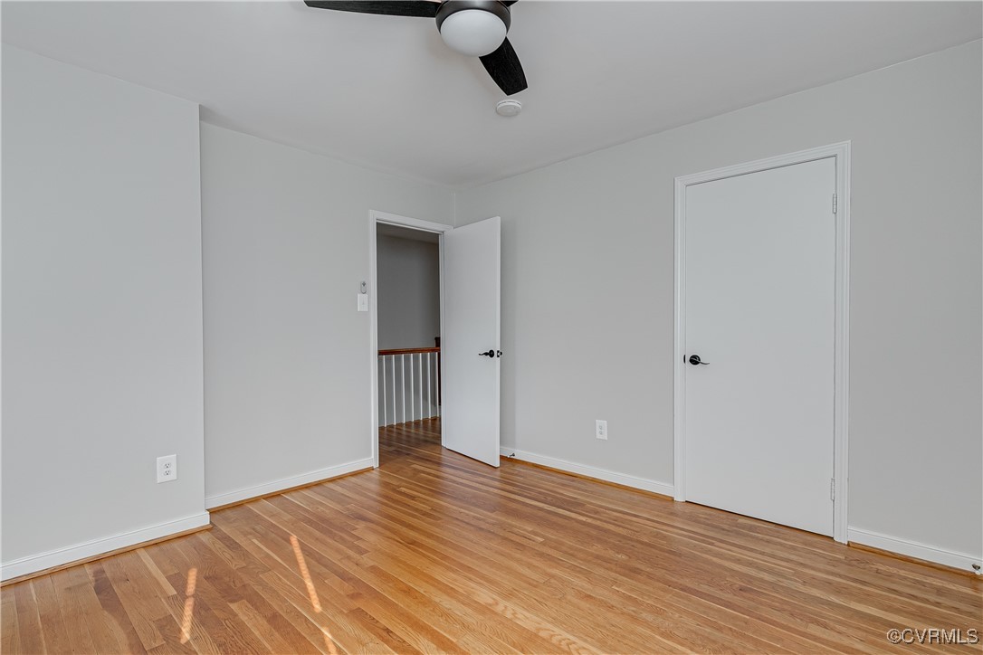 10231 Epsilon Road Richmond, VA 23235 - Photo 28 of 42 a view of an empty room with wooden floor