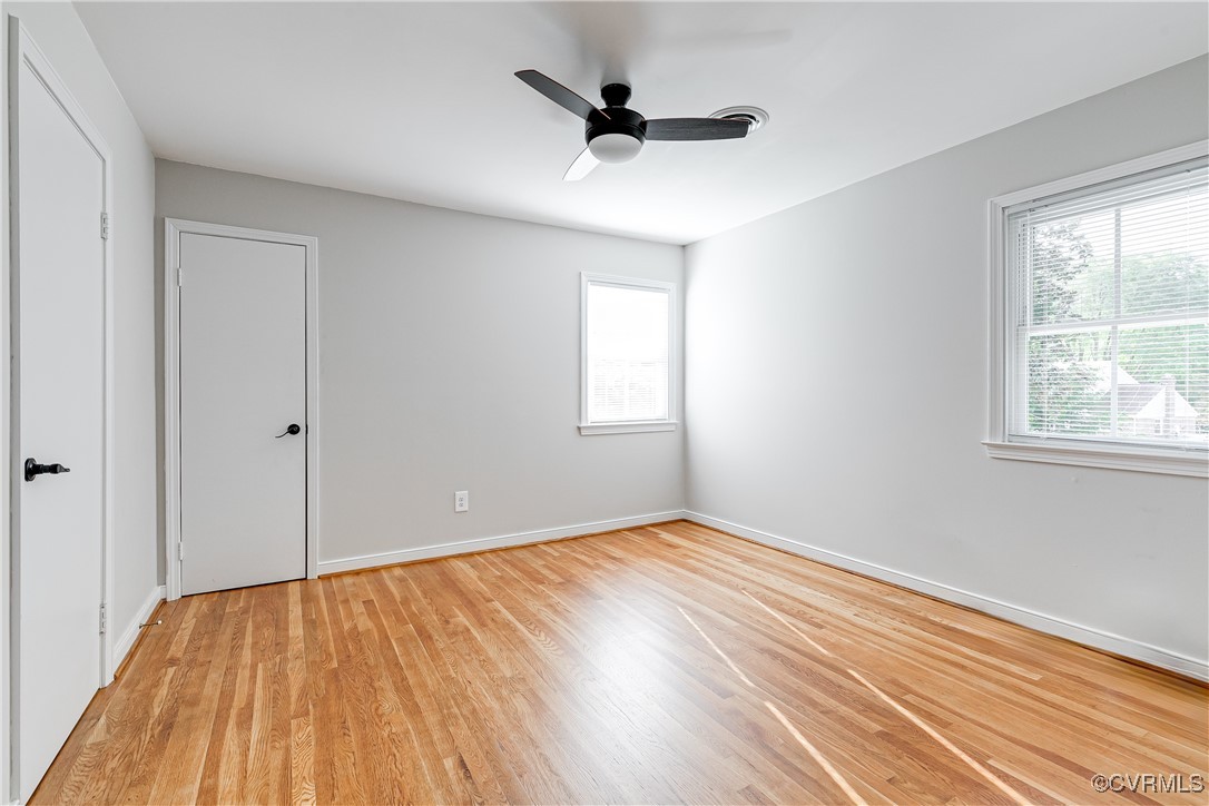 10231 Epsilon Road Richmond, VA 23235 - Photo 29 of 42 a view of empty room with wooden floor and fan