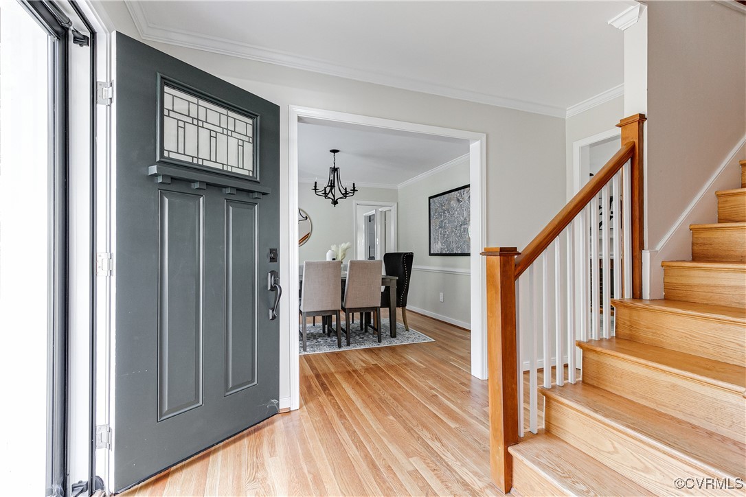 10231 Epsilon Road Richmond, VA 23235 - Photo 3 of 42 a view of a hallway with wooden floor and staircase