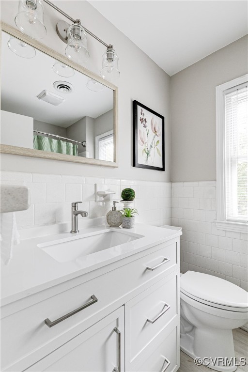10231 Epsilon Road Richmond, VA 23235 - Photo 33 of 42 a bathroom with a sink mirror vanity and toilet