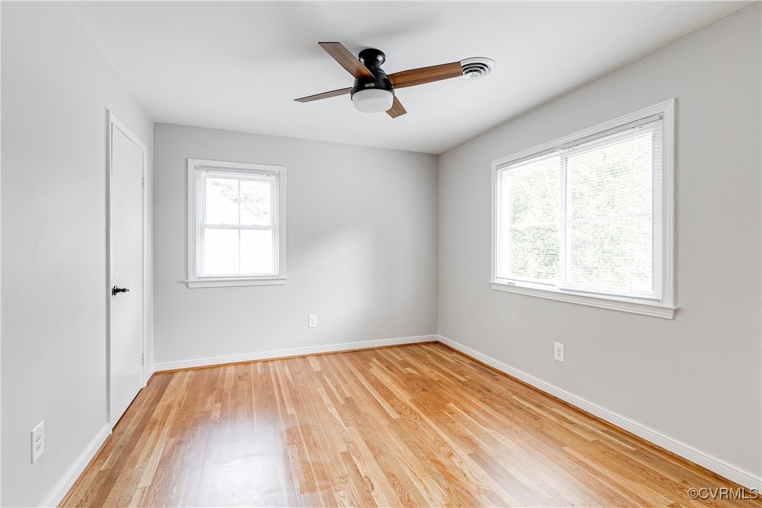 10231 Epsilon Road Richmond, VA 23235 - Photo 35 of 42 a view of empty room with wooden floor and fan