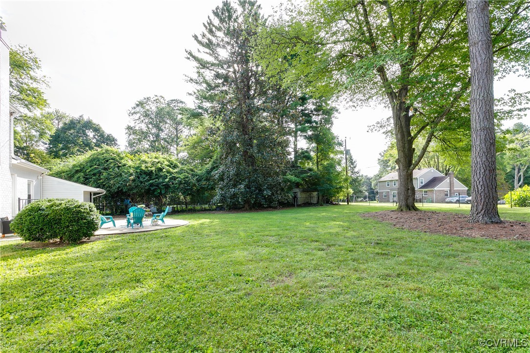 10231 Epsilon Road Richmond, VA 23235 - Photo 39 of 42 a backyard of a house with lots of green space