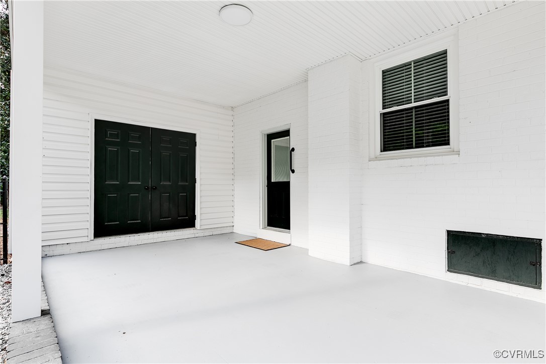 10231 Epsilon Road Richmond, VA 23235 - Photo 40 of 42 a view of an empty room with cabinet and a window