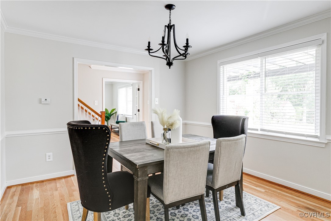 10231 Epsilon Road Richmond, VA 23235 - Photo 9 of 42 a view of a dining room with furniture window and wooden floor