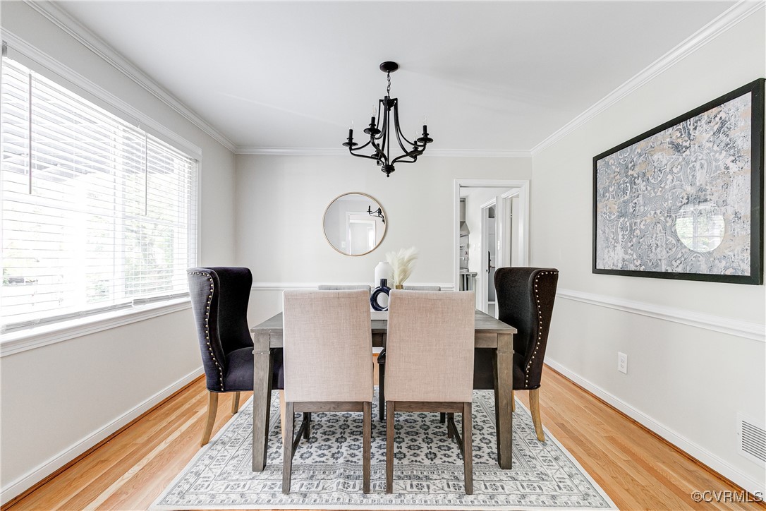 10231 Epsilon Road Richmond, VA 23235 - Photo 10 of 42 a view of a dining room with furniture window and wooden floor