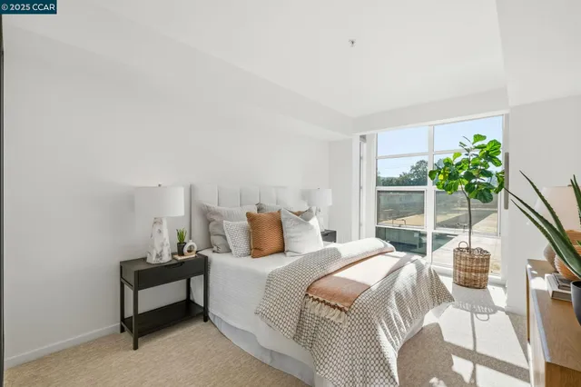 a bedroom with a bed and a potted plant