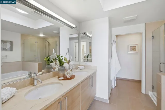 a bedroom with a bed and a lamp