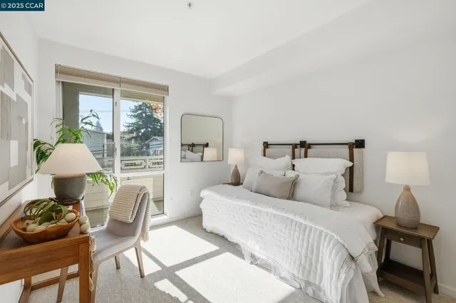 a bedroom with a bed and a potted plant