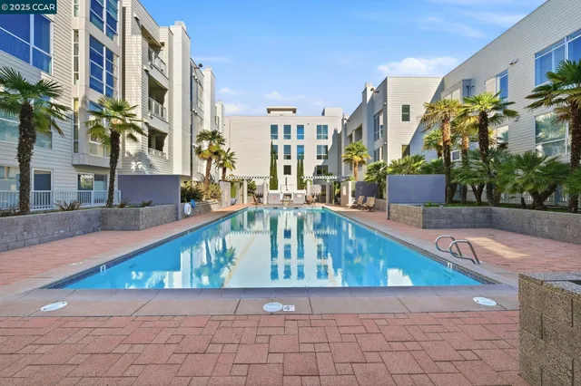 a view of a patio with a dining table and chairs