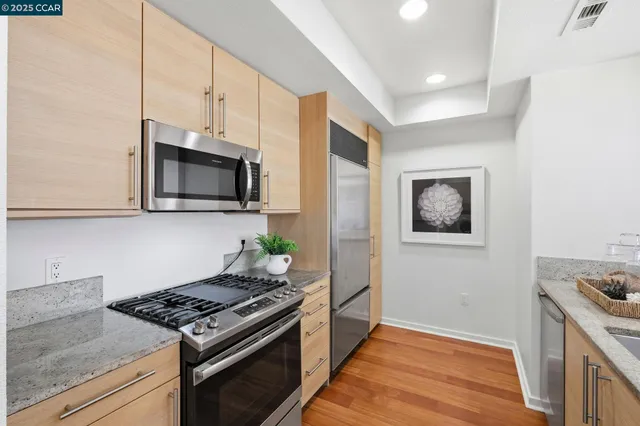 a kitchen with a stove and a microwave