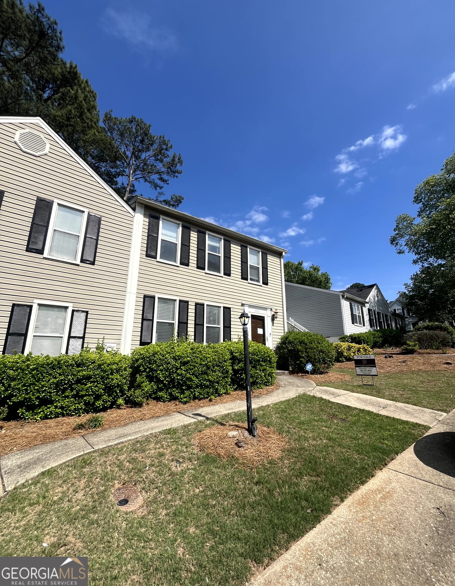 3403 Spring Harbour Drive Atlanta, GA 30340 - Photo 5 of 9 a front view of a house with a yard and trees