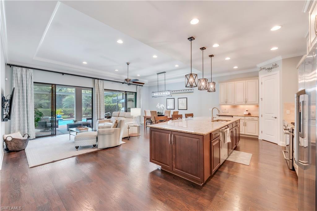a kitchen with stainless steel appliances granite countertop a stove oven and a refrigerator