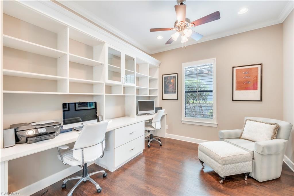 23778 Pebble Pointe Lane Estero, FL 34135 - Photo 18 of 35 a work room with furniture wooden floor and windows