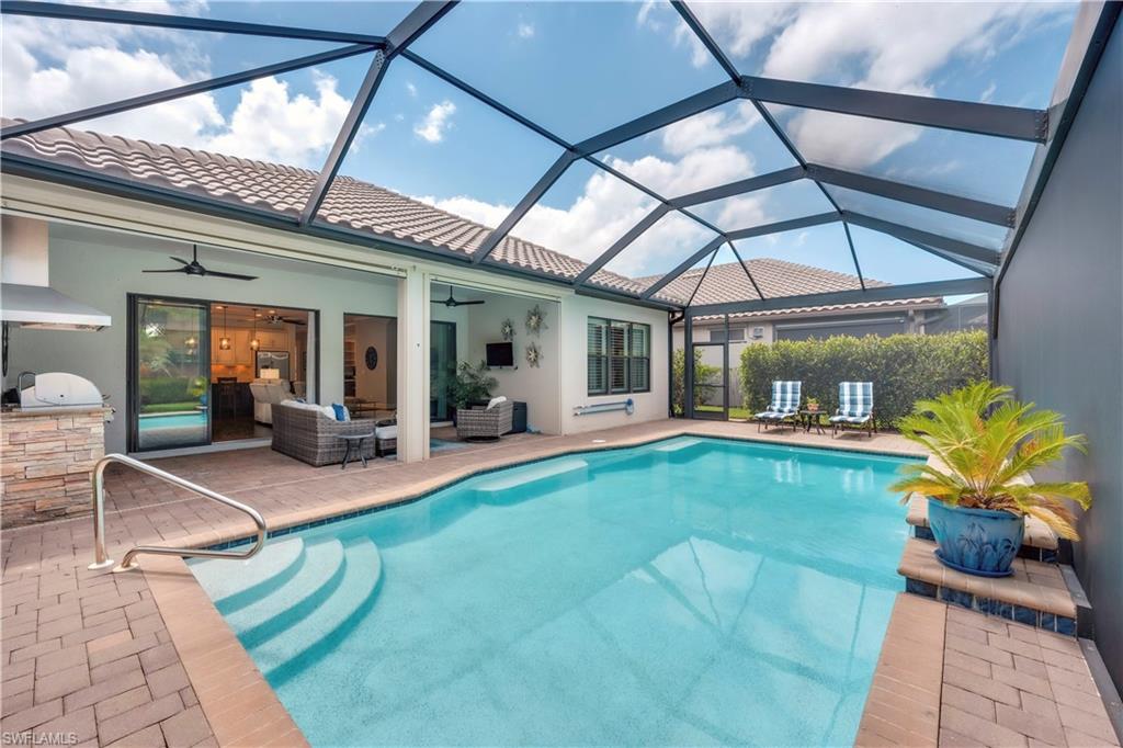 23778 Pebble Pointe Lane Estero, FL 34135 - Photo 2 of 35 a view of a house with backyard porch and patio