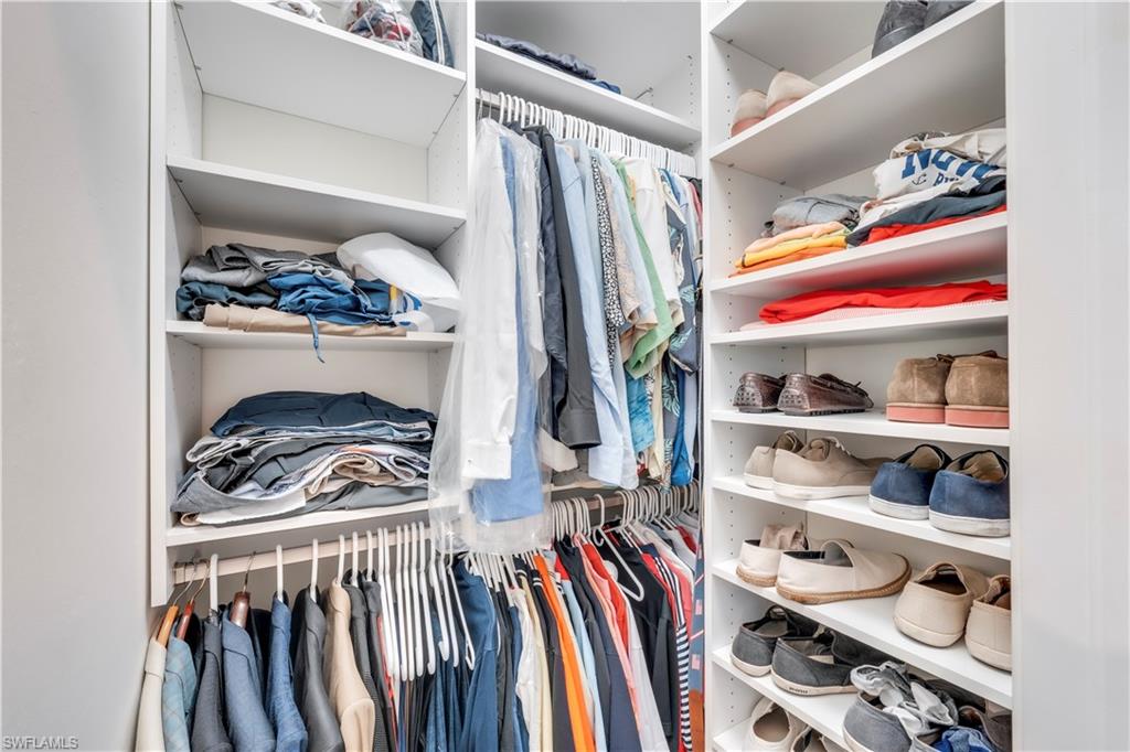 23778 Pebble Pointe Lane Estero, FL 34135 - Photo 22 of 35 a view of walk in closet with clothes and shoes