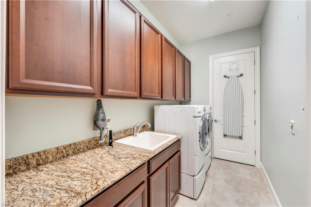 23778 Pebble Pointe Lane Estero, FL 34135 - Photo 30 of 35 a bathroom with a sink and a mirror