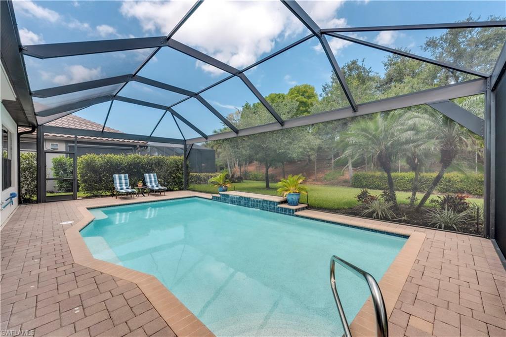 23778 Pebble Pointe Lane Estero, FL 34135 - Photo 3 of 35 a view of a swimming pool with a porch