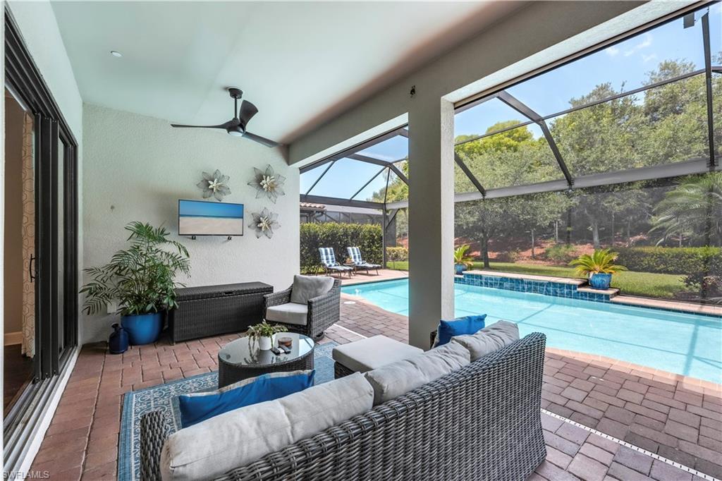 23778 Pebble Pointe Lane Estero, FL 34135 - Photo 6 of 35 a living room with furniture and a large window