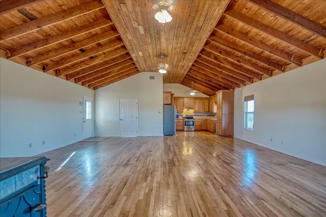 a view of a livingroom with wooden floor