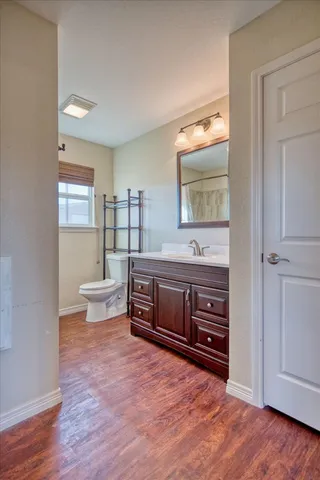 a bathroom with a toilet a sink and bathtub