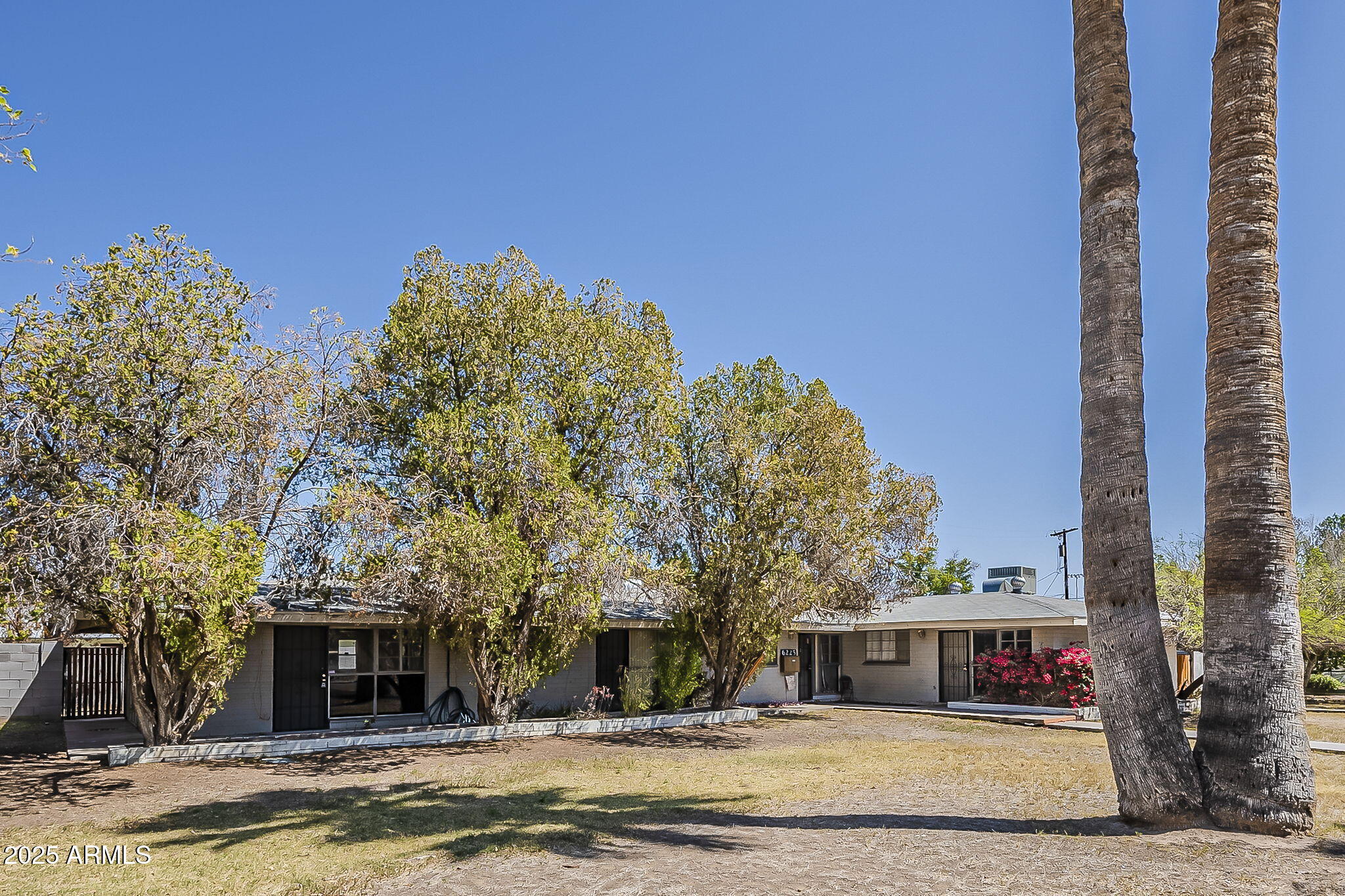 6225 North 10th Place Phoenix, AZ 85014 - Photo 1 of 32 a front view of a building with streets and trees