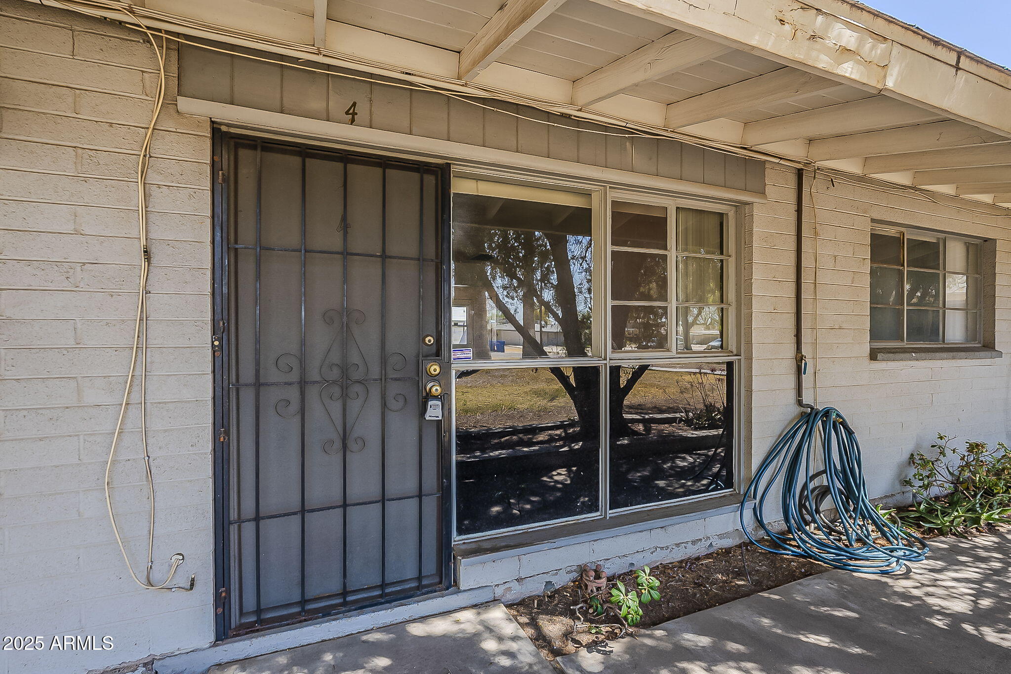 6225 North 10th Place Phoenix, AZ 85014 - Photo 2 of 32 a view of a porch with a glass door and glass door