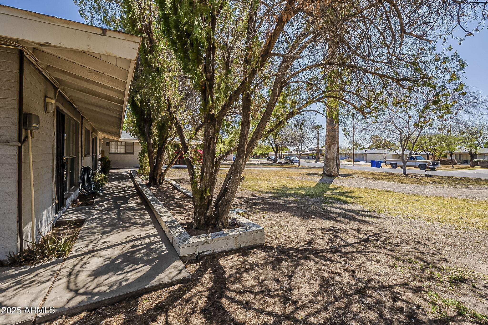 6225 North 10th Place Phoenix, AZ 85014 - Photo 30 of 32 a view of a yard with trees