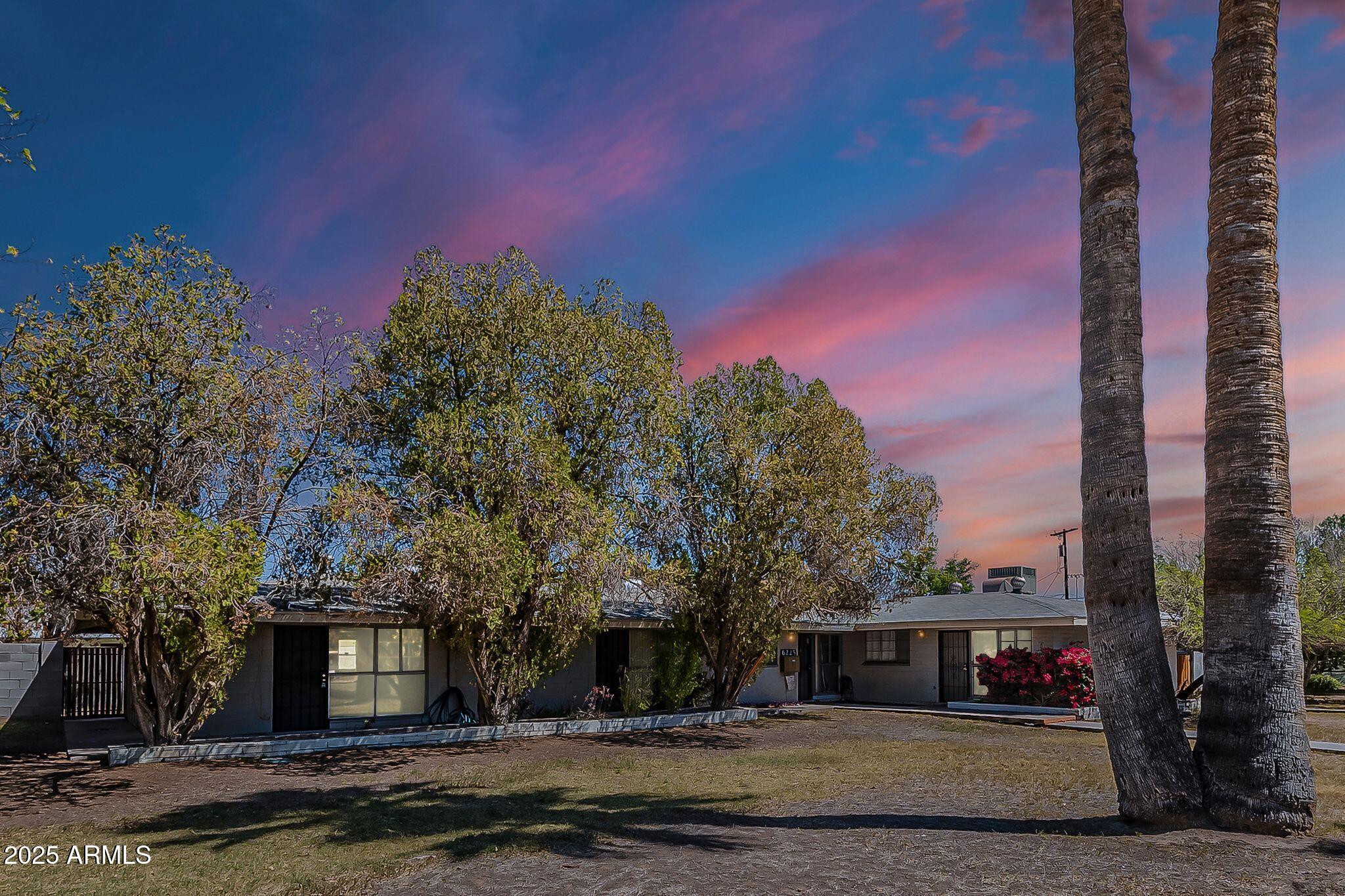 6225 North 10th Place Phoenix, AZ 85014 - Photo 32 of 32 a front view of a house with a yard